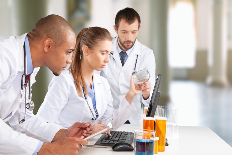 A team of pharmaceutical experts analyzing lab results and research data, representing JD Pharm Consultancy as a trusted Pharma consultancy company in Nigeria.